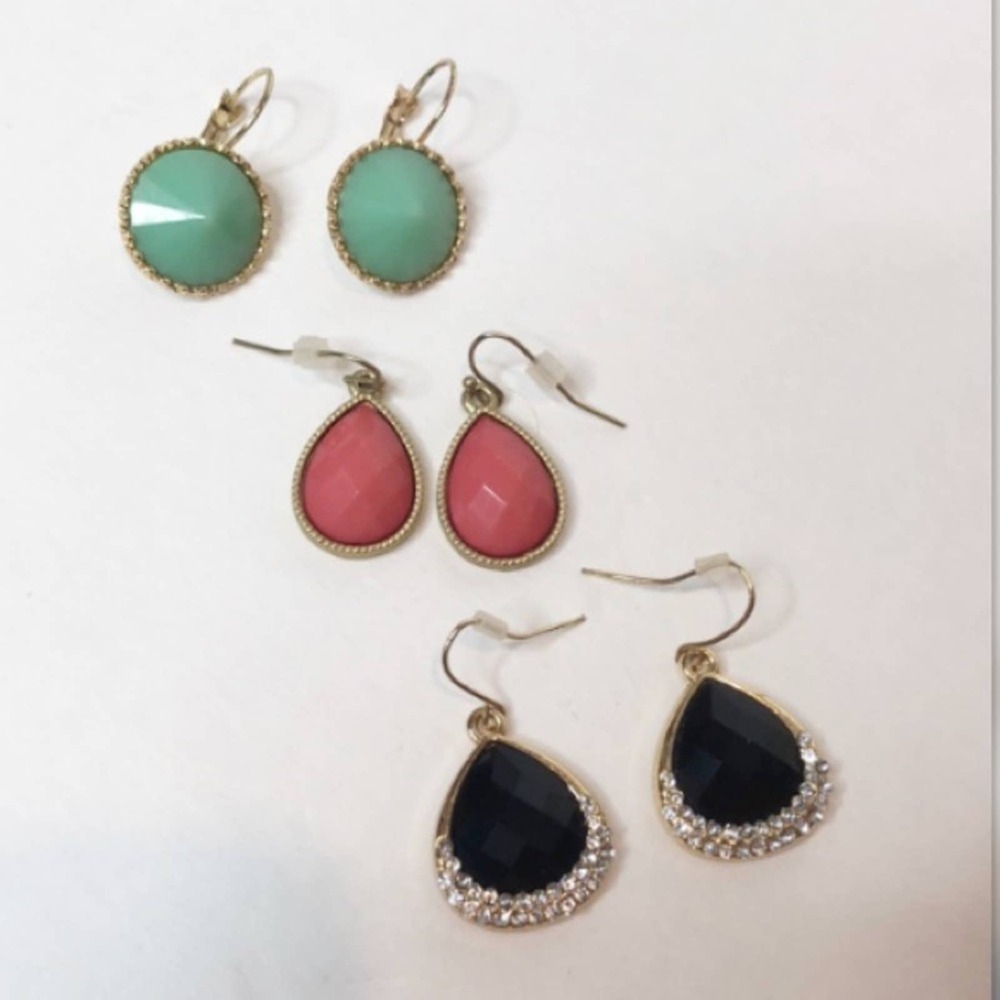 Bundle of three gold dangle earrings